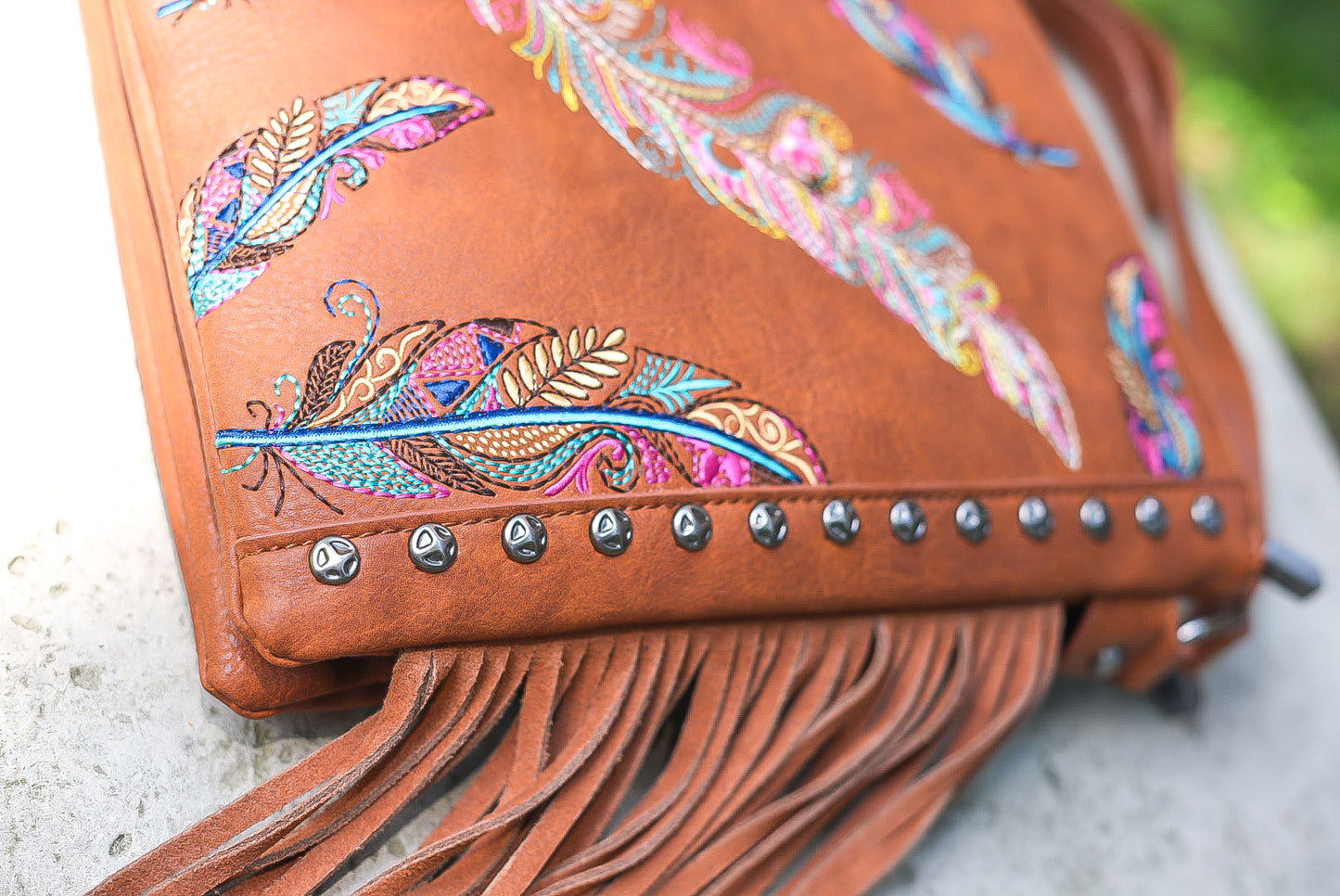 Tan boho feather purse Montana west